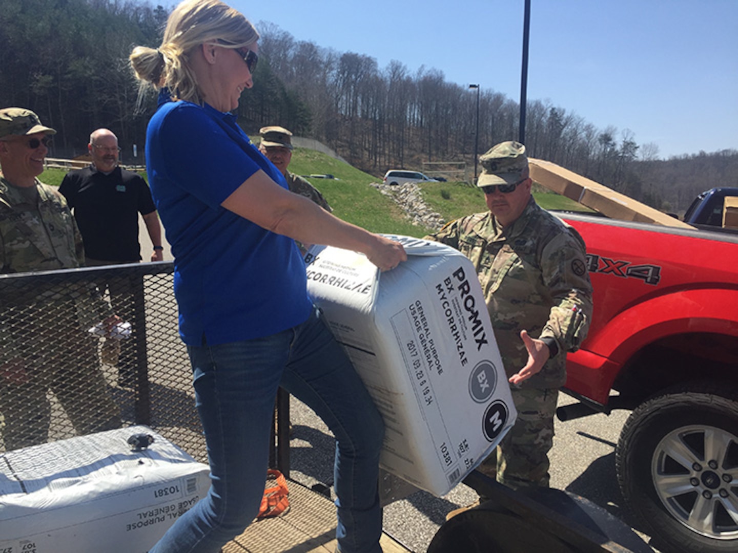 Participants are receiving supplies from West Virginia State University Extension Service for those of the West Virginia National Guard's Patriot Guardens educational program. Each participant receives seeds, a 3x8 raised bed and 2 bales of Pro Mix Soil to get started. The participants then purchase additional soil and compost to add to the raised bed as their contribution.