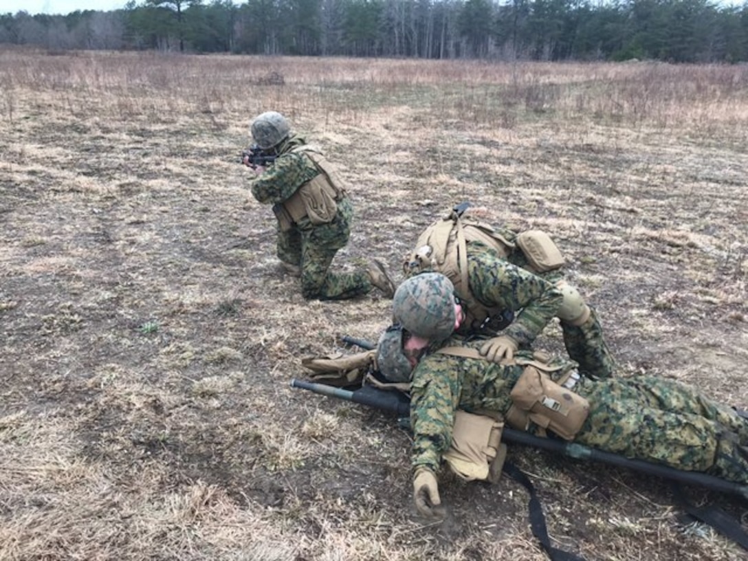 Corpsmen and Marines with Company C., 1st Battalion, 25th Marine Regiment, 4th Marine Division, Marine Forces Reserve, conduct a cherrypicker casualty evacuation simulation during a platoon attack as part of a Mission Rehearsal Exercise aboard U.S .Army Fort A.P. Hill, Va., April 6, 2018. Along with its combat engineer battalion, combat logistics battalion, assault amphibious vehicle and artillery attachments, 1st Bn., 25th Marines, conducted a 10-drill MRX in preparation for Integrated Training Exercise 4-18. This MRX was a stepping stone in a force generation plan to ensure that once 1st Bn., 25th Marines, 1st Bn., 23rd Marines, and other ready bench units complete ITX 4-18, they will be ready to rapidly respond to a national security threat with maximum capability. (Courtesy photo provided by 1st Bn., 25th Marines)