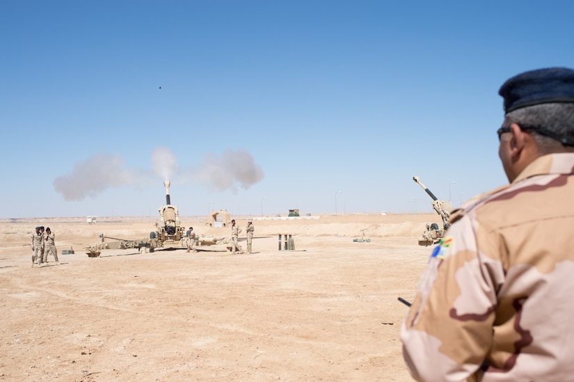 Iraqi soldier fires artillery.