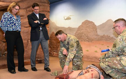 Mark T. Esper, Secretary of the Army, gets a demonstration by Maj. (Dr.) Stephen Harper at the 232nd Medical Battalion during a guided tour of the 232nd Medical Battalion 68W Advanced Individual Training, or AIT, Program for the Combat Medic Program at Joint Base San Antonio-Fort Sam Houston April 17.