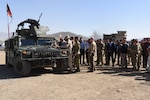 NYPD Police Commissioner James O’Neil (center) fires an M249 Squad Automatic Weapon during his visit to the Crisis Response Unit (CRU) 222 in Kabul, Afghanistan, Apr. 11, 2018. Critical Response Unit (CRU) 222 is one of three National Mission Units that fall under the command and control of the General Command Police Special Unit. CRU 222 is the primary Afghan National Defense and Security Forces (ANDSF) capability for providing rapid response to high profile attacks within Kabul and the diplomatic community.