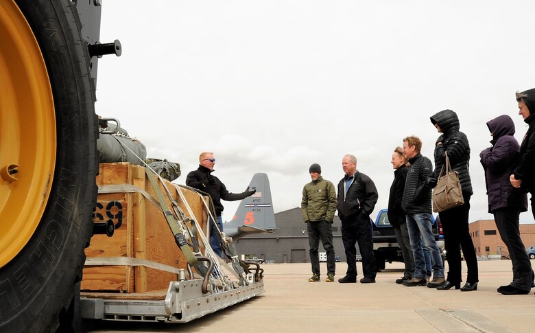 Tech. Sgt. Christopher Meyer, a 39th Aerial Port Squadron air transportation technician, explains the 39th APS aerial delivery mission to members of the 302nd Airlift Wing’s Partners in Leadership program during the program’s first event at Peterson Air Force Base, Colorado, April 13, 2018. The program is designed to grow existing relations between military and community leadership and is slated to feature three other events during 2018. (U.S. Air Force photo by Staff Sgt. Frank Casciotta)