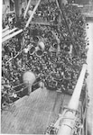 Soldiers of the 105th Field Artillery on board the troopship Mercury in Newport News, Virginia,  in May 1918 as the 27th Division, the New York National Guard's division, leaves the United States for France in World War I. This photograph appeared in Maj. Gen. John F O'Ryan's book, "The Story of the 27th Division."