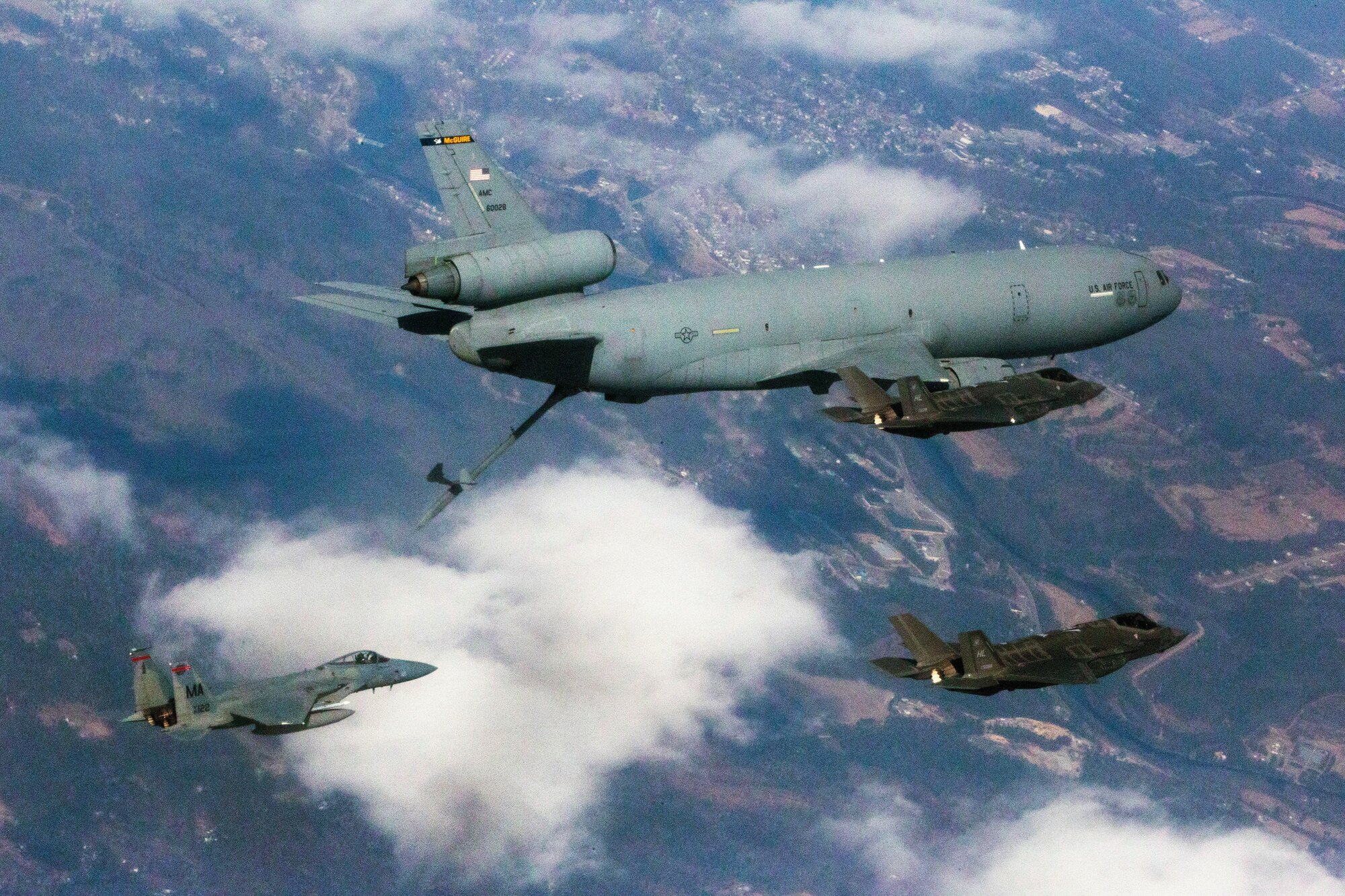 A pair of U.S Air Force F-35 Lightning IIs with the 419th Fighter Squadron fly alongside a KC-10 Extender crewed by Reserve Citizen Airmen with the 78th Air Refueling Squadron, 514th Air Mobility Wing, as an F-15 Eagle with the 104th Fighter Squadron approaches during a joint training mission over the United States, April 7, 2018. The 514th is an Air Force Reserve Command (AFRC) unit located at Joint Base McGuire-Dix-Lakehurst, N.J. The 419th is an AFRC unit assigned to Hill Air Force Base, Utah. The 104th is with the Massachusetts Air National Guard located at Barnes Air National Guard Base. (U.S. Air Force photo by Master Sgt. Mark C. Olsen)