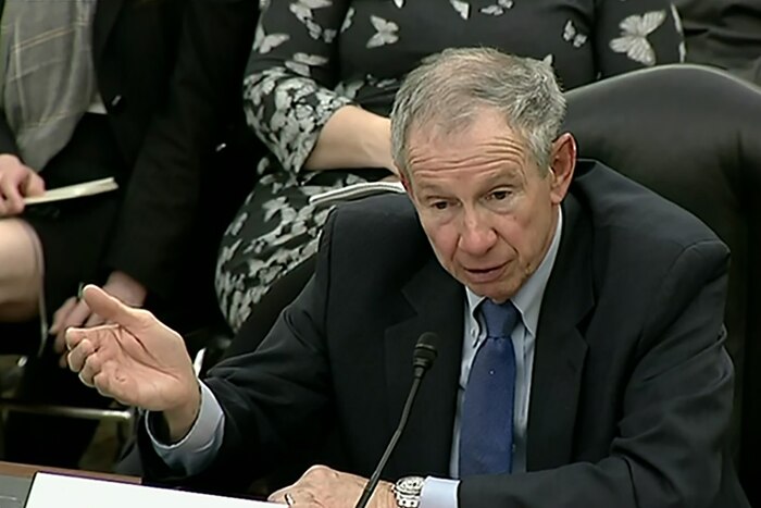 Michael D. Griffin, undersecretary of defense for research and engineering, sits in front of a microphone.