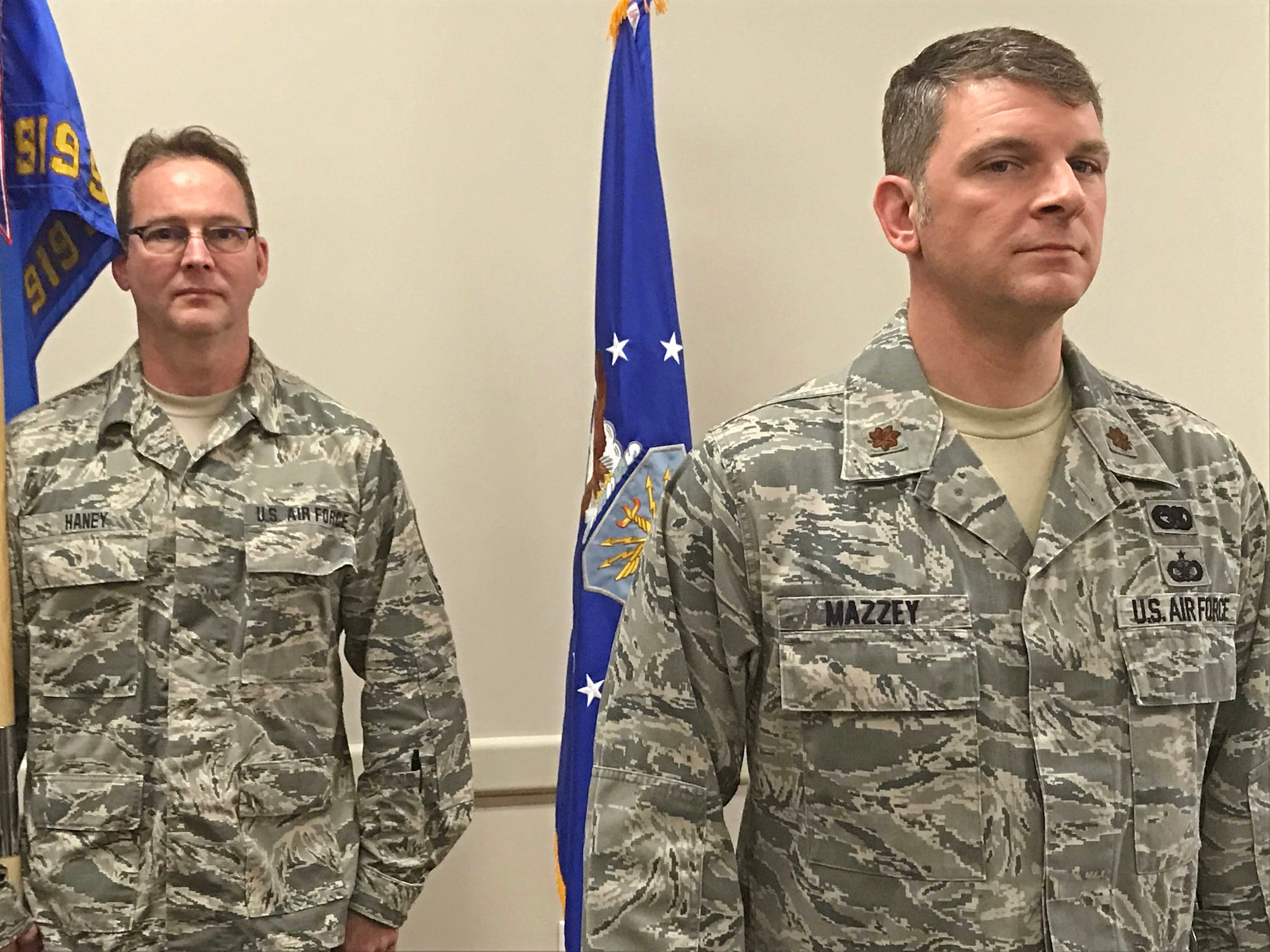 Maj. Chris Mazzey stands at attention as he is formally introduced as the new commander of the 919th Special Operations Logistics Readiness Squadron