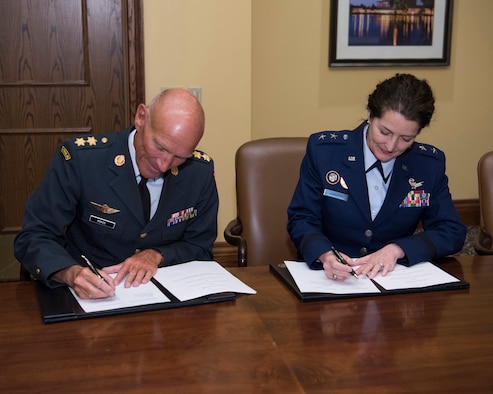 U.S. Air Force Maj. Gen. Nina Armagno (right), U.S. Strategic Command (USSTRATCOM) director of plans and policy, signs a memorandum of understanding at the 34th Annual Space Symposium Apr. 17, 2018, with Maj. Gen. Agner Rokos, representing the Defence Command Denmark and the Ministry of Defence Denmark. The memorandum authorizes sharing space situational awareness services and information with the Defence Command and Ministry of Defence for Denmark. Denmark joins 13 nations (the United Kingdom, the Republic of Korea, France, Canada, Italy, Japan, Israel, Spain, Germany, Australia, the United Arab Emirates, Belgium and Norway), two intergovernmental organizations (the European Space Agency and the European Organization for the Exploitation of Meteorological Satellites) and more than 65 commercial satellite owner/operator/launchers already participating in SSA data-sharing agreements with USSTRATCOM.