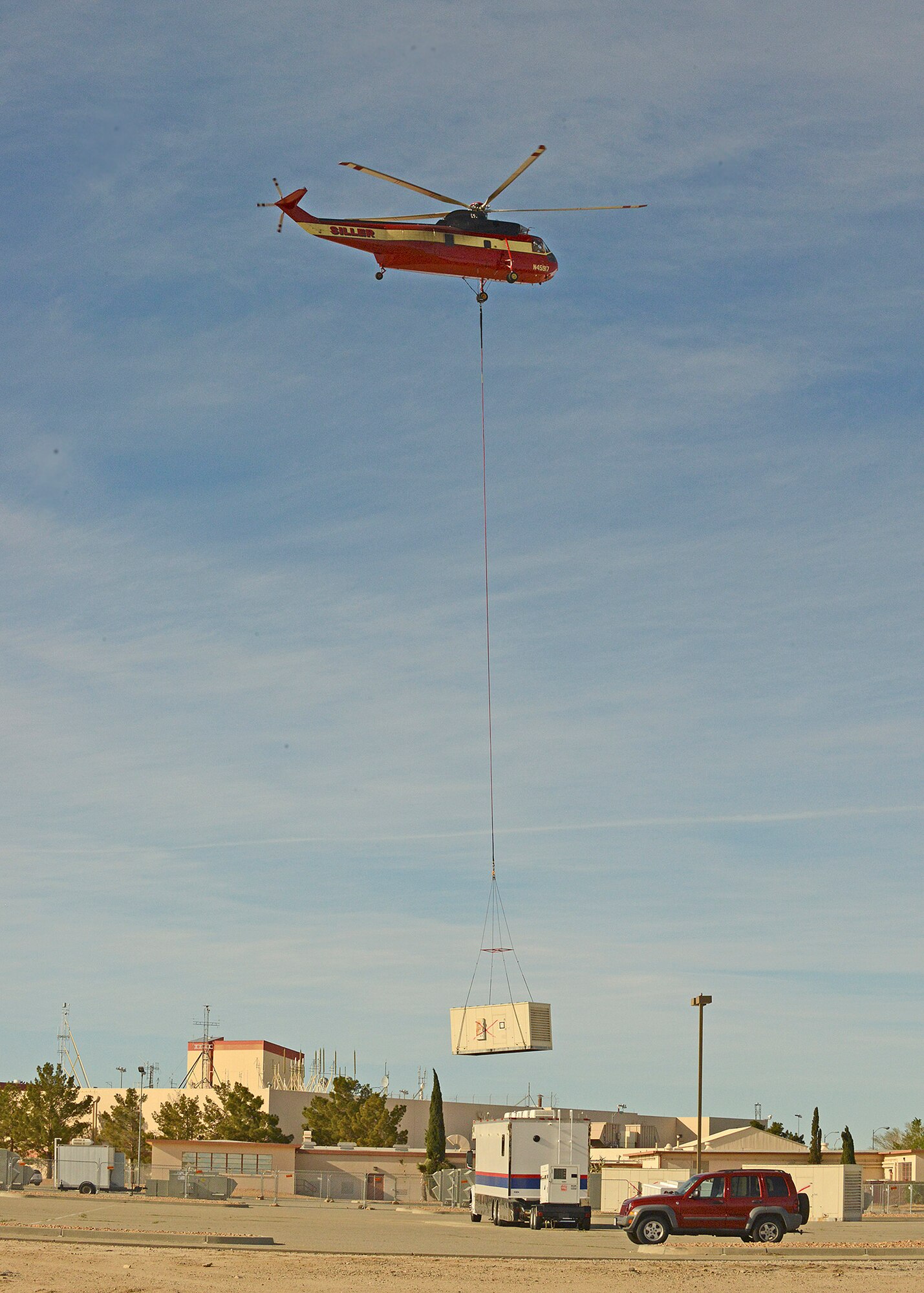Siller Helicopters, Inc. flew in an S-61V Sikorsky to replace 22 evaporative coolers on the 412th Maintenance Group’s headquarters building. Seven of the coolers also had heaters as part of the unit.