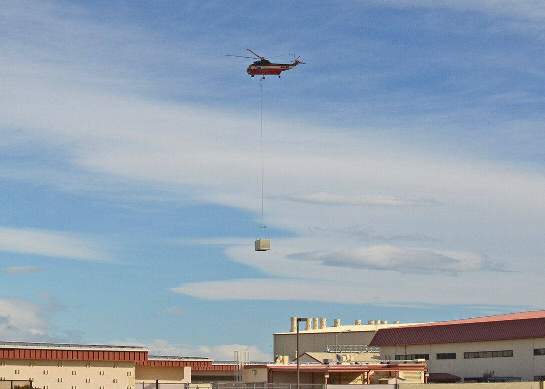 Siller Helicopters, Inc. flew in an S-61V Sikorsky to replace 22 evaporative coolers on the 412th Maintenance Group’s headquarters building. Seven of the coolers also had heaters as part of the unit.