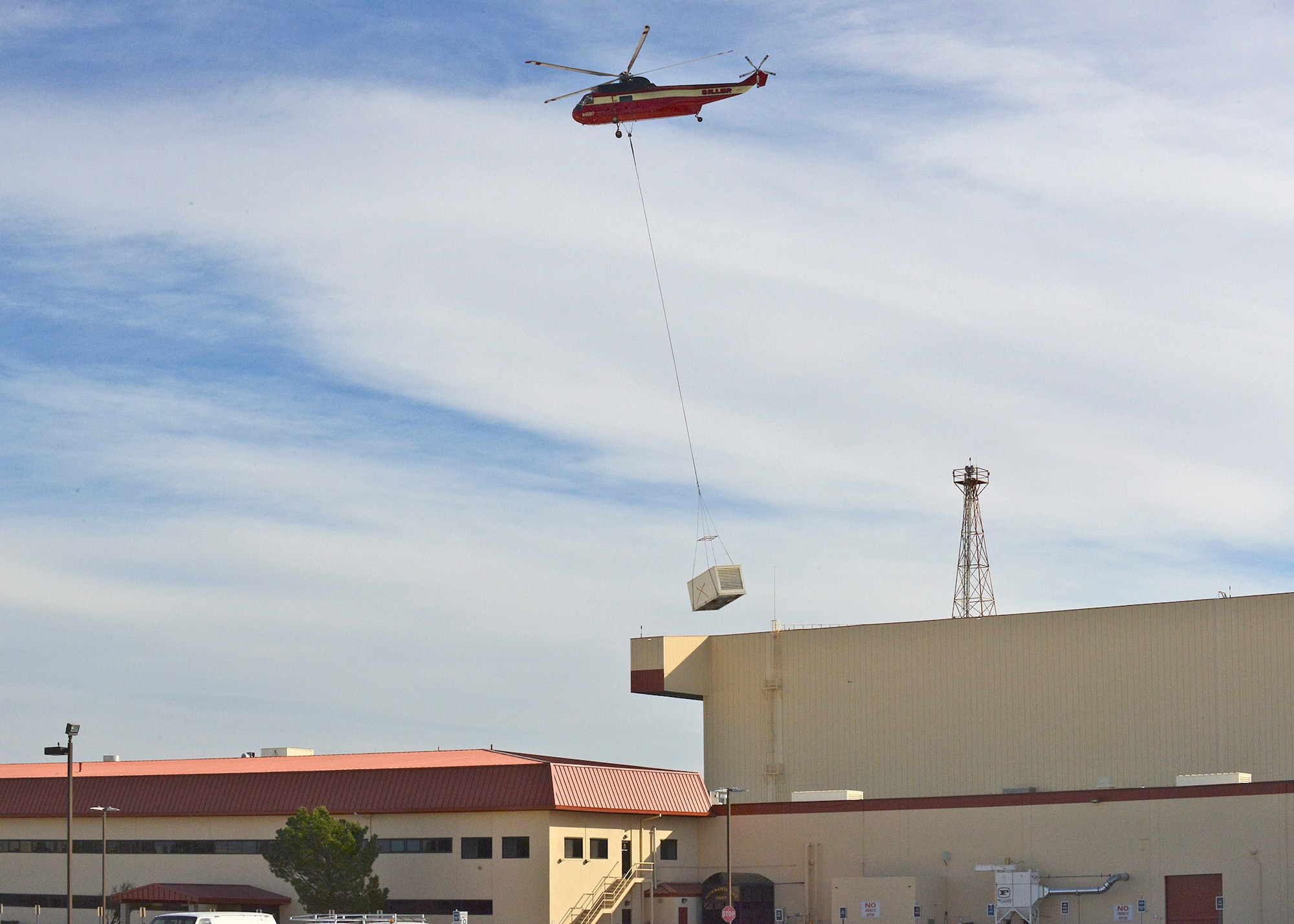 Siller Helicopters, Inc. flew in an S-61V Sikorsky to replace 22 evaporative coolers on the 412th Maintenance Group’s headquarters building. Seven of the coolers also had heaters as part of the unit.