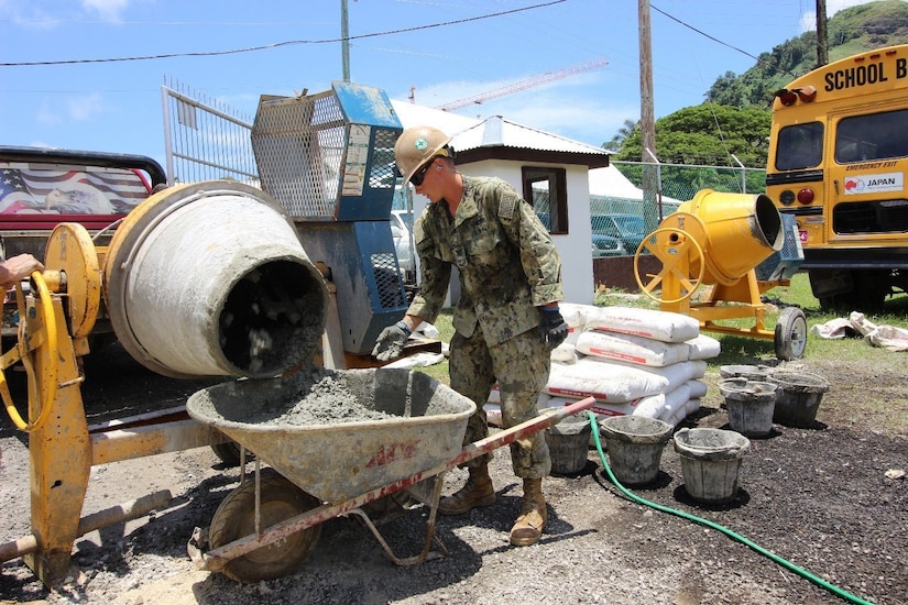 Navy seaman works at a construction site.