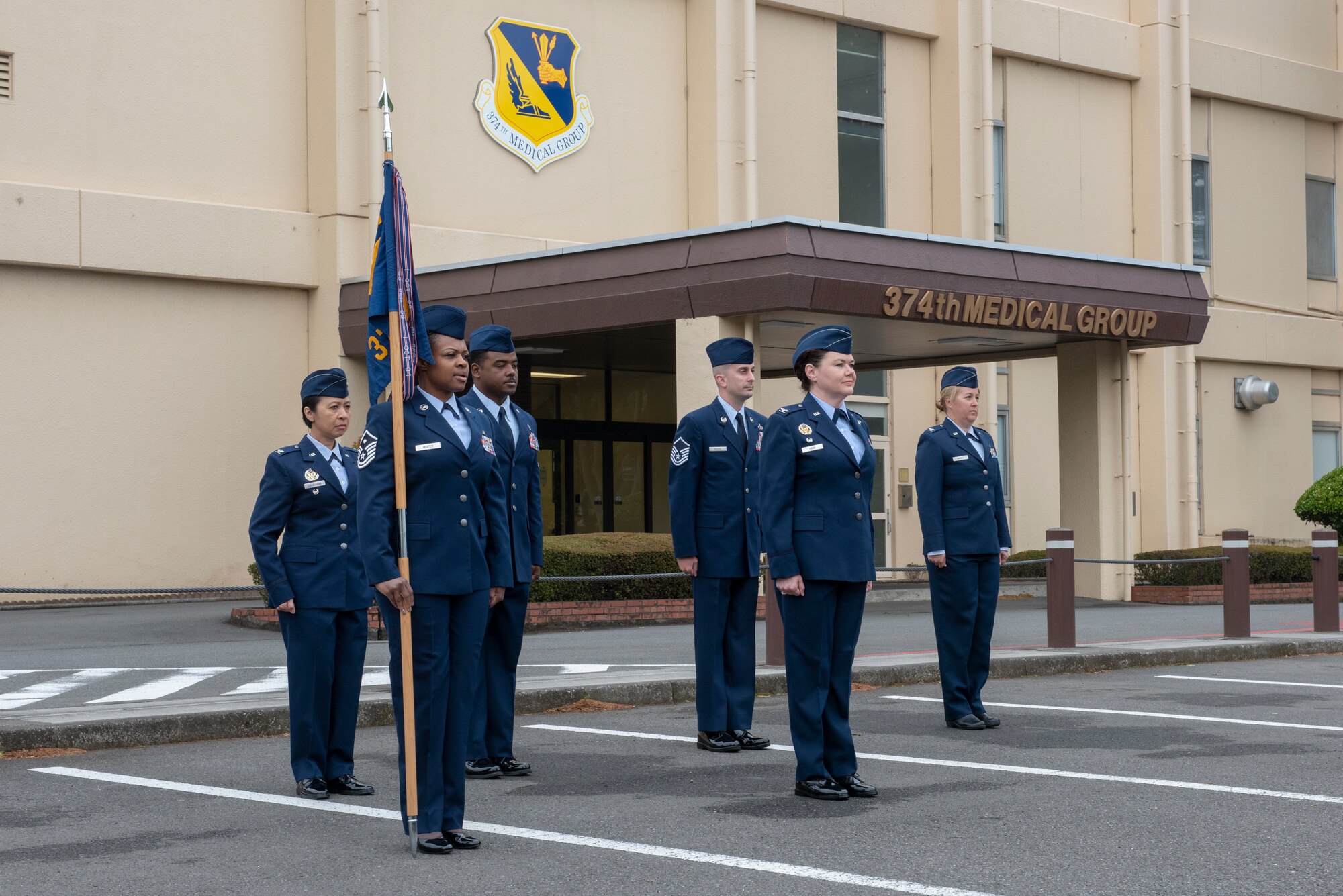 Col. Ingrid Ford, 374th Medical Group commander, acts as the reviewing officer during an open-ranks inspection at Yokota Air Base, Japan, April 19, 2018.