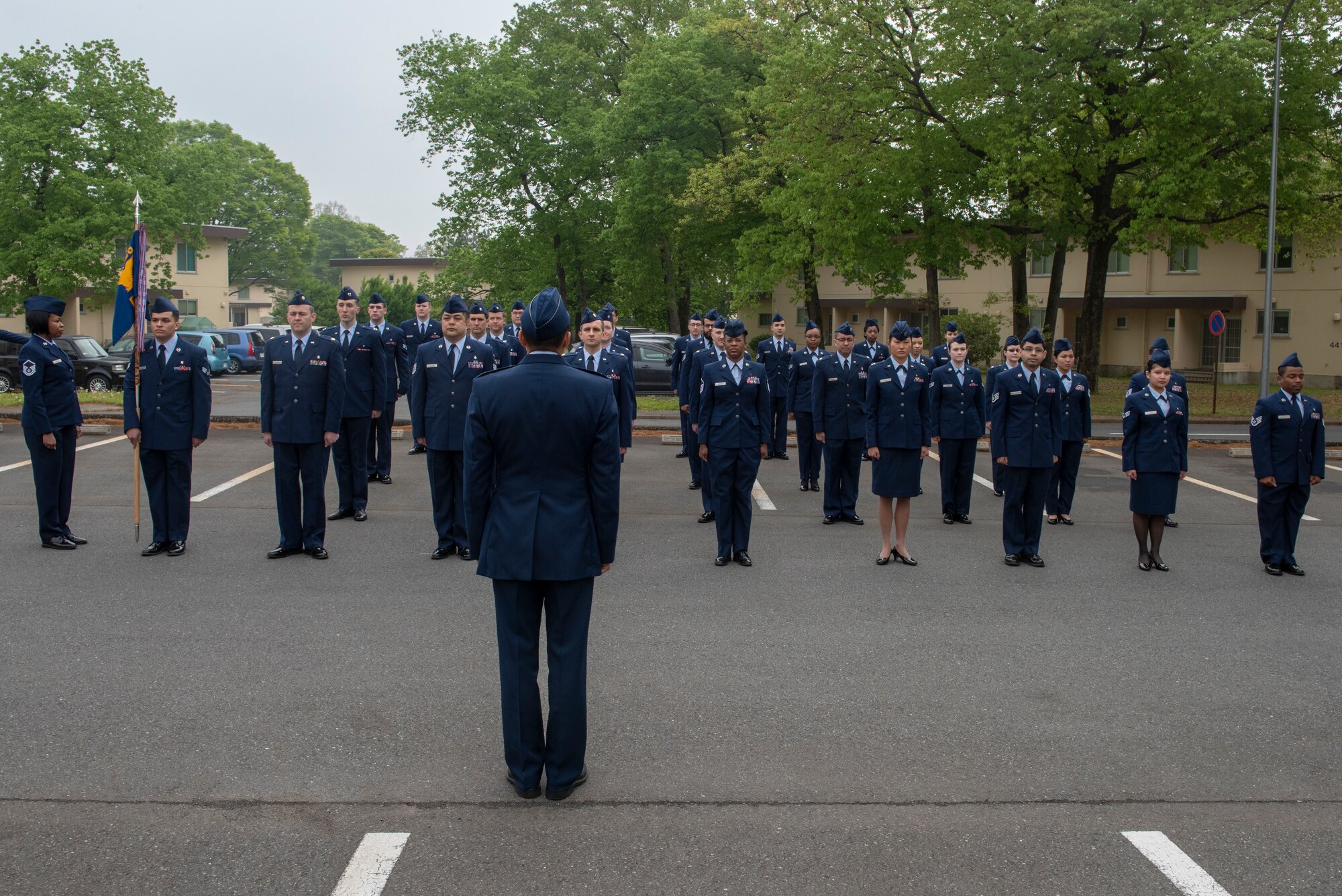 Airmen from the 374th Medical Group stand in formation during an open-ranks inspection at Yokota Air Base, Japan, April 19, 2018.