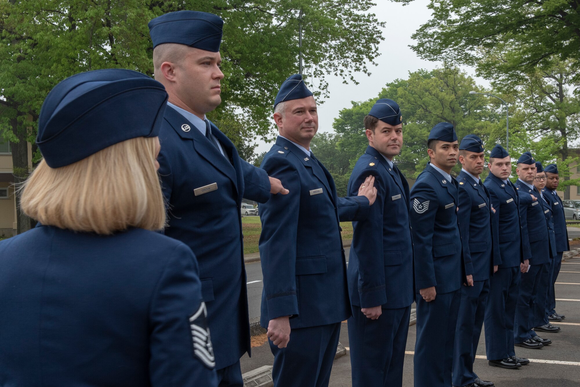 Airmen from the 374th Medical Group respond to a dress-right-dress command during an open-ranks inspection at Yokota Air Base, Japan, April 19, 2018.