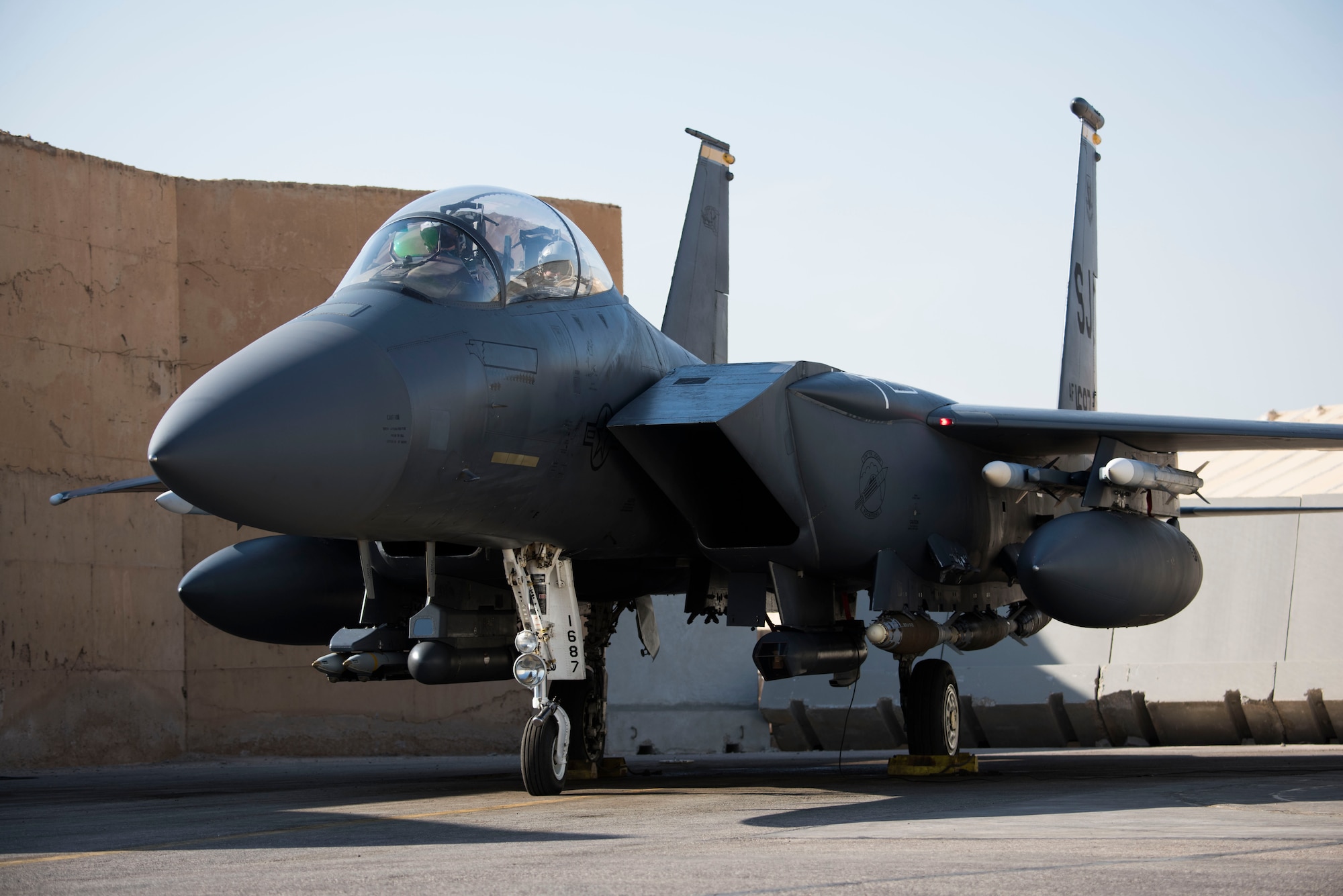 A 332nd Air Expeditionary Fighter Squadron pilot and weapon system officer prepare for takeoff in an F-15E Strike Eagle March 7, 2018, at an undisclosed location in Southeast Asia.