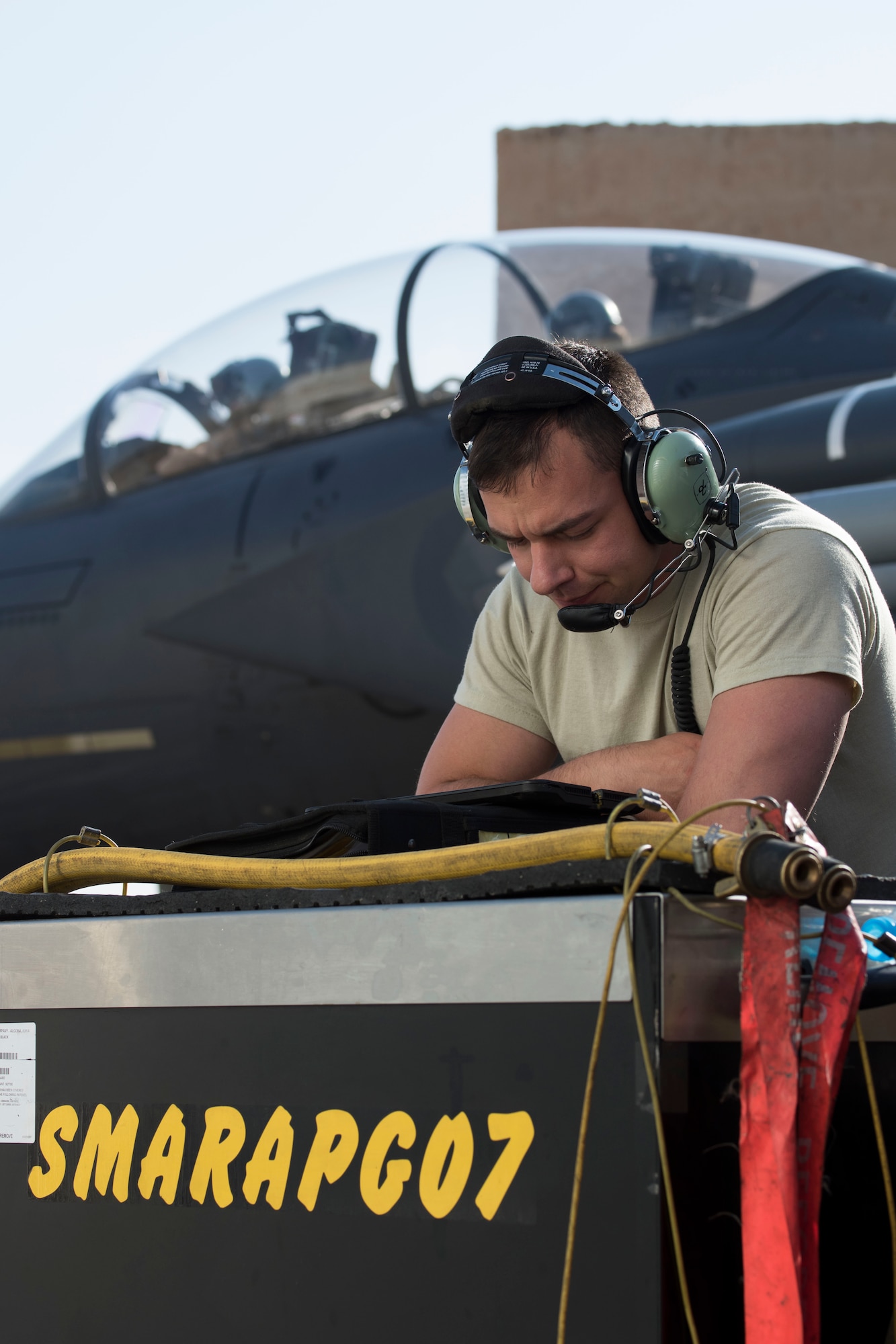 A 332nd Expeditionary Maintenance Squadron crew chief gets equipment to assist with completing pre-checks to for an F-15E Strike Eagle prior to launch March 7, 2018, at an undisclosed location in Southeast Asia.
