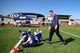 Kyle Rudolph, NFL Minnesota Viking’s tight end, “high fives” a camp attendee during the free NFL camp at the Kaiserslautern High School football stadium on Kapaun Air Base, Germany, April 7, 2018. Approximately 150 boys and girls attended the two-day camp.