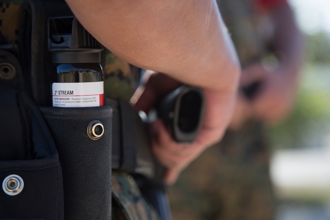 Lance Cpl Henry Garcia 11-18 Area guardsmen, carries deterrents such as Oleoresin Capsicum spray to be effective in their job of maintaining order on Camp Pendleton, Calif., April 17, 2018. Area guardsmen on Camp Pendleton receive counter-terrorism training, qualify with pistols and shotguns, and receive combat lifesaving training to maintain proficiency when responding to emergency situations.