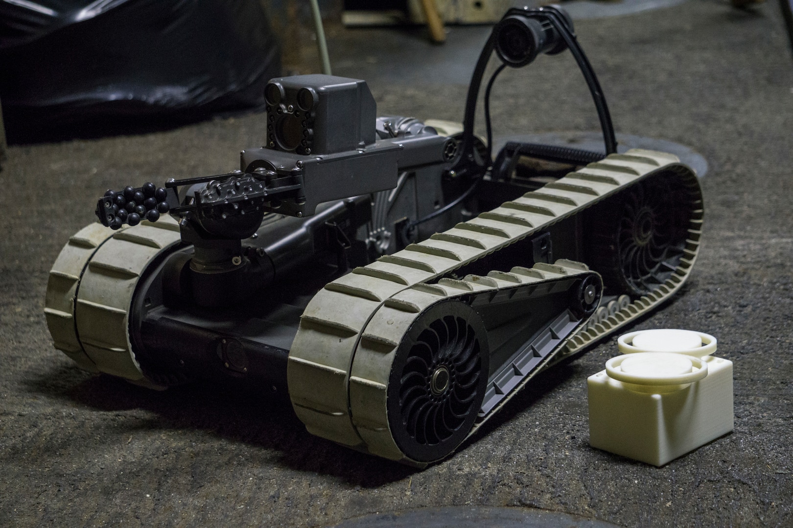 An iRobot 310 Small Unmanned Ground Vehicle belonging to Combat Logistic Battalion 31, 31st Marine Expeditionary Unit, sits staged with 3-D printed lens covers aboard the USS Wasp while underway in the Pacific Ocean, April 17, 2018. Marines with CLB-31 are now capable of ‘additive manufacturing,’ also known as 3-D printing, which is the technique of replicating digital 3-D models as tangible objects.  The 31st Marine Expeditionary Unit partners with the Navy’s Amphibious Squadron 11 to form the Wasp Amphibious Ready Group, a cohesive blue-green team capable of accomplishing a variety of missions across the Indo-Pacific.