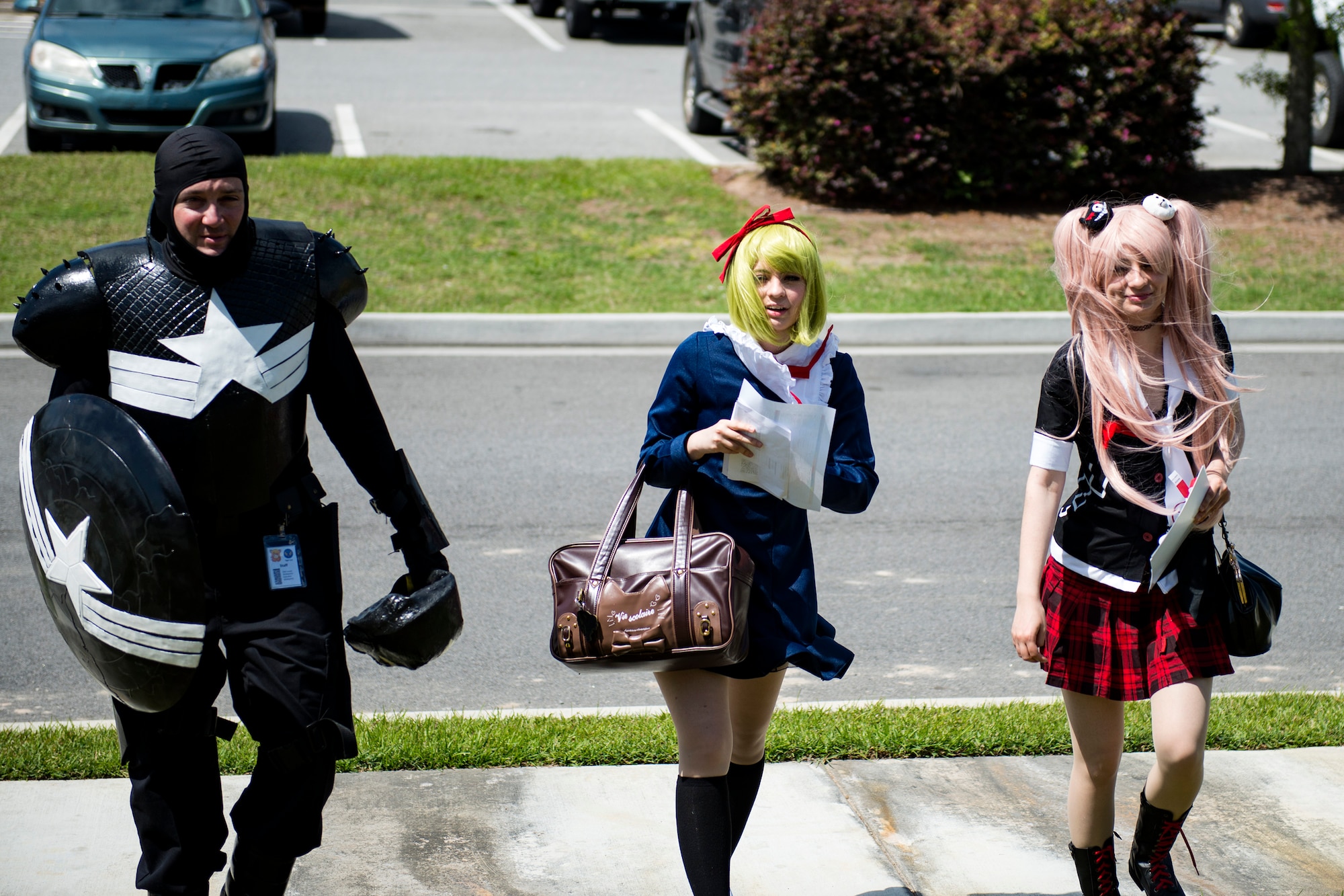 Staff Sgt. William Hannay, left, 723d Aircraft Maintenance Squadron weapons team chief, Kaycie, center, and Kayle Ackerman, cosplayers, walk to an event while at Tiger Con, April 14, 2018, in Valdosta, Ga. Tiger Con was a convention, open to Moody residents and the local community, geared toward giving pop culture enthusiasts a chance to dress and role play as their favorite movie, TV show or comic characters. The event included a costume contest, an anime themed café, pop-culture artist panels along with shopping vendors and a guest appearance of veteran voice actor Richard Epcar, who’s known for portraying Raiden in the video series Mortal Kombat. (U.S. Air Force photo by Airman 1st Class Erick Requadt)