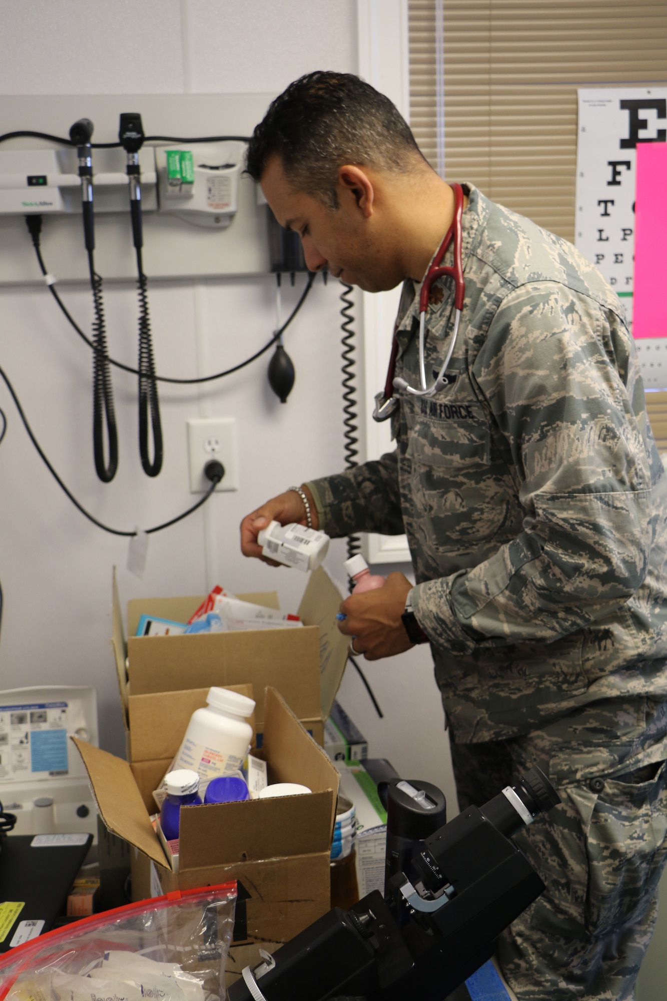 Major Vashun Rodriguez a flight surgeon assigned to the 927th Aeromedical Staging Squadron, MacDill Air Force Base FL, selects the proper antibiotic for a patient at the Kivalina Clinic, Kivalina, Alaska, April 18, 2018 in support of Arctic Care. Innovative Readiness Training exercises such as Arctic Care 2018 continue to build on the long-standing tradition of U.S. Armed Forces addressing the underserved community health and civic needs of the Northwest Arctic Borough. (U.S. Air Force photo by Maj. Joseph Simms)