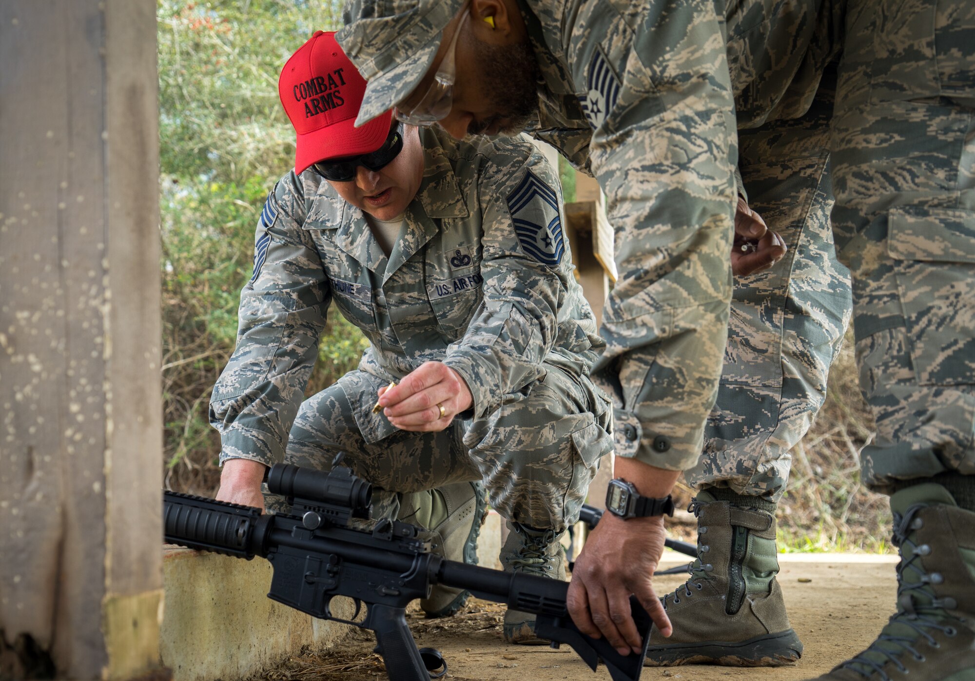 Chief Master Sgt. Neal Bethune, 403rd Security Forces Squadron manager, instructs Reserve Citizen Airmen at the firing range as a part of their routine weapons training March 5, 2018 in Biloxi, Mississippi. Bethune has served as a security forces defender for more than 27 years. (U.S. Air Force photo by Staff Sgt. Shelton Sherrill)