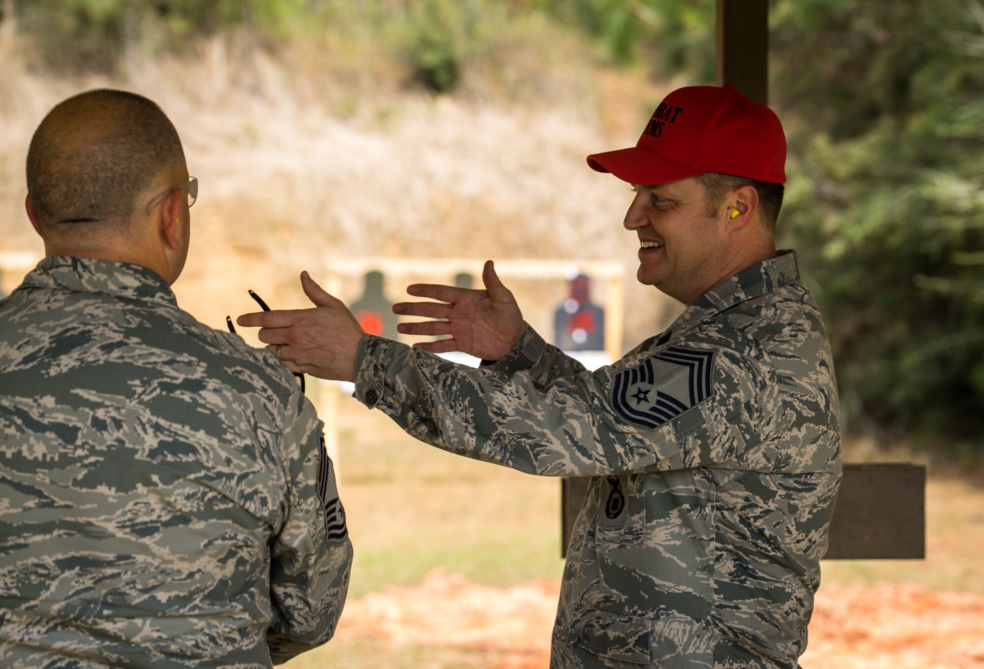 Chief Master Sgt. Neal Bethune, 403rd Security Forces Squadron manager, instructs Reserve Citizen Airmen at the firing range as a part of their routine weapons training March 5, 2018 in Biloxi, Mississippi. Bethune has served as a security forces defender for more than 27 years. (U.S. Air Force photo by Staff Sgt. Shelton Sherrill)