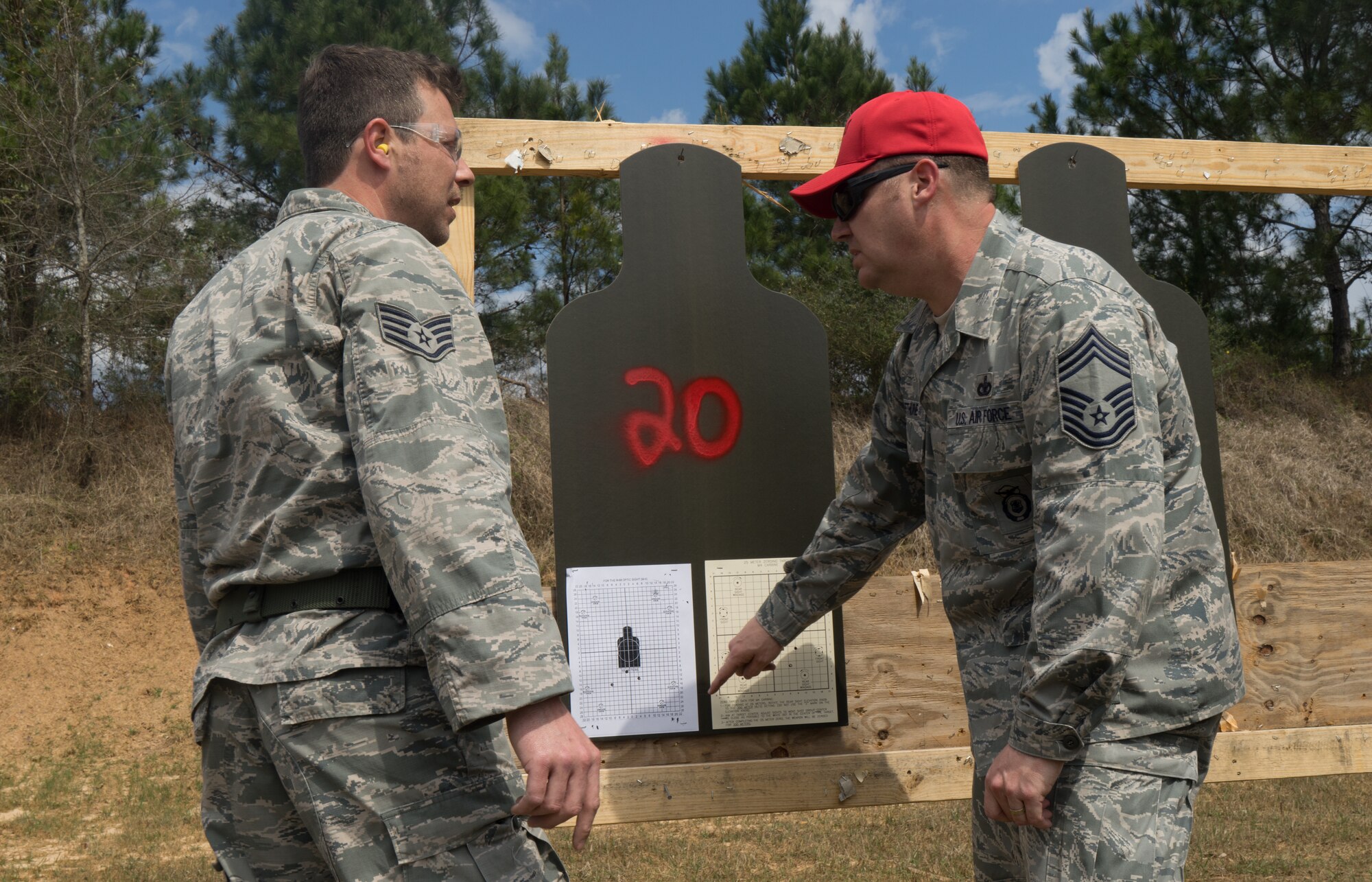 Chief Master Sgt. Neal Bethune, 403rd Security Forces Squadron manager, instructs Reserve Citizen Airmen at the firing range as a part of their routine weapons training March 5, 2018 in Biloxi, Mississippi. Bethune has served as a security forces defender for more than 27 years. (U.S. Air Force photo by Staff Sgt. Shelton Sherrill)