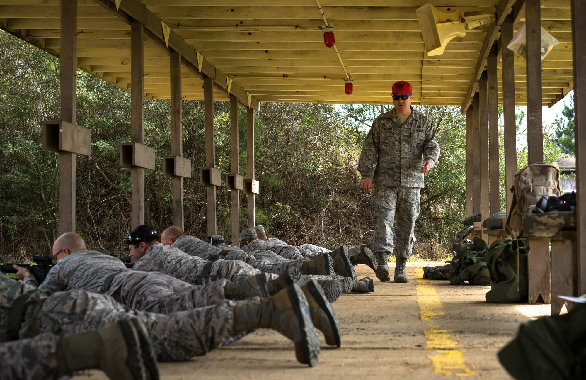 Chief Master Sgt. Neal Bethune, 403rd Security Forces Squadron manager, instructs Reserve Citizen Airmen at a range as a part of their routine weapons training March 5, 2018 in Biloxi, Mississippi. Bethune has served as a security forces defender for more than 27 years. (U.S. Air Force photo by Staff Sgt. Shelton Sherrill)