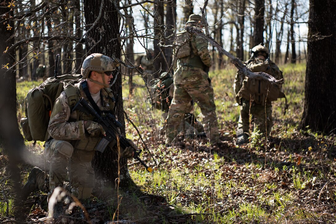 A Tactical Air Control Party specialist provides oversight for his team while participating in a field training exercise, or FTX, at Fort Chaffee Maneuver Training Center in Arkansas, April 15, 2018. The FTX, April 13-17, 2018, took place at the end of a two-month Initial Combat Skills Training Course, which is hosted by the 138th Combat Training Flight at Will Rogers Air National Guard Base in Oklahoma City, and is the only one of its kind in the U.S. Air Force. (U.S. Air National Guard Photo by Staff Sgt. Kasey M. Phipps)