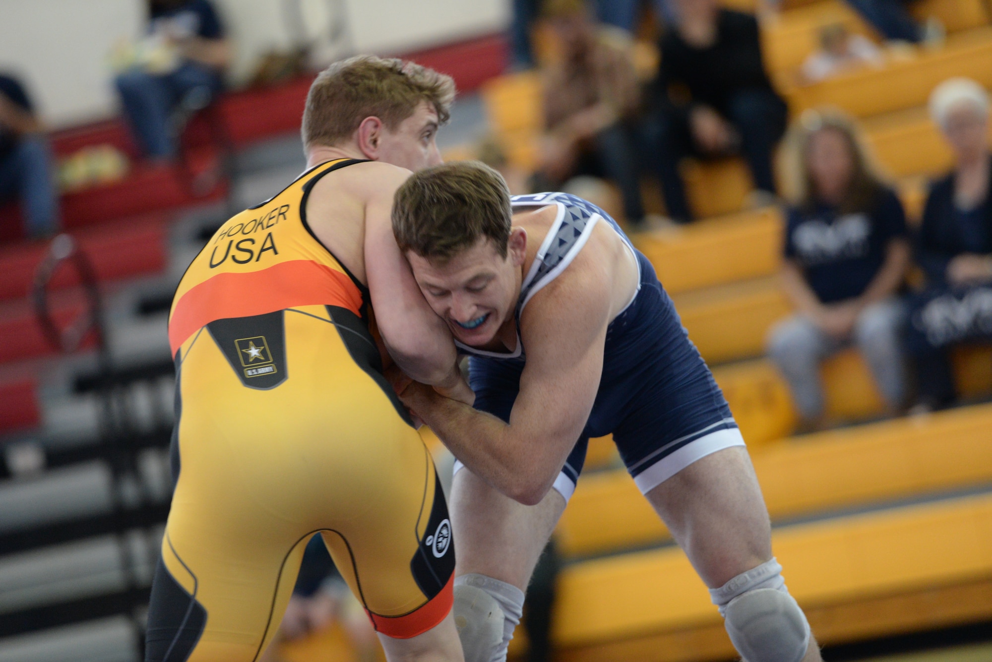 Capt. Brandon Mueller in blue grapples with the Army's Michael Hooker at the 2017 Armed Forces Championships.