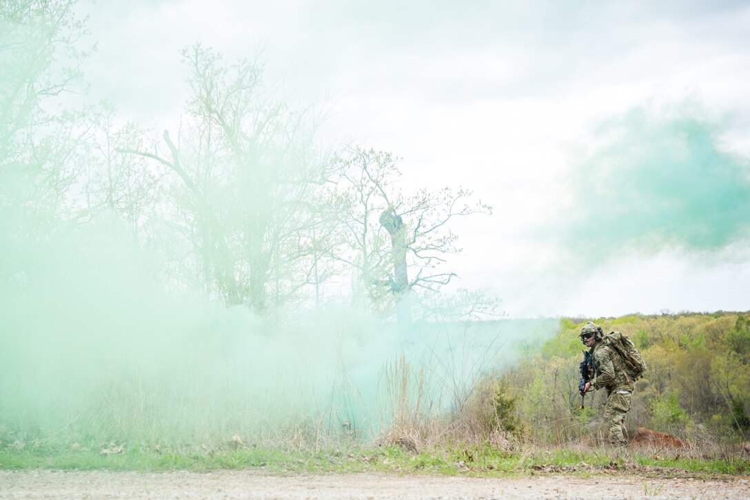 A Tactical Air Control Party specialist approaches an enemy position while participating in a field training exercise, or FTX, at Fort Chaffee Maneuver Training Center in Arkansas, April 14, 2018. The FTX, April 13-17, 2018, took place at the end of a two-month Initial Combat Skills Training Course, which is hosted by the 138th Combat Training Flight at Will Rogers Air National Guard Base in Oklahoma City, and is the only one of its kind in the U.S. Air Force. (U.S. Air National Guard Photo by Staff Sgt. Kasey M. Phipps)