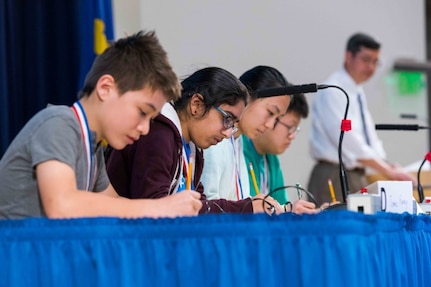 Students from regional elementary and middle schools participate in the MATHCOUNTS-style speed round as Dr. Paul Shang, acting technical director for Naval Surface Warfare Center, Carderock Division, feeds them the math problems at the Carderock Math Contest in West Bethesda, Md., on April 13, 2018. (U.S. Navy photo by Jake Cirksena/Released)