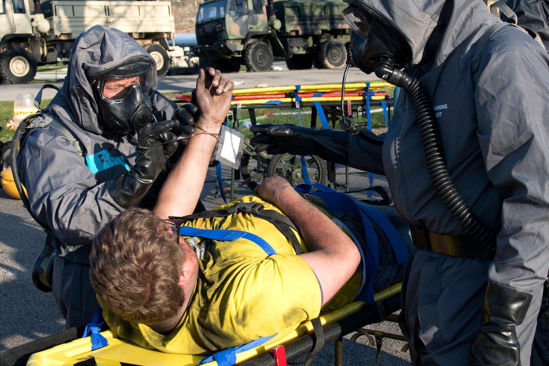 A soldiers processes a simulated casualty during a training exercise.