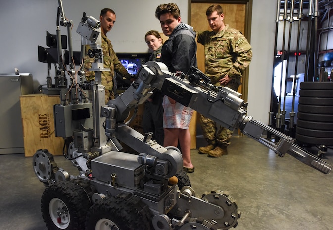 Explosive Ordnance Disposal Airmen with the 628th Civil Engineer Squadron show Airman for a Day participants an EOD robot April 12, 2018, at Joint Base Charleston, S.C.