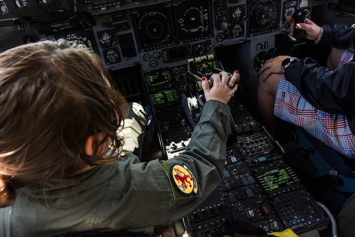 Jessica Rye, 17-year-old cancer survivor, pretends to operate the controls of a C-17 Globemaster III April 12, 2018, at Joint Base Charleston, S.C.