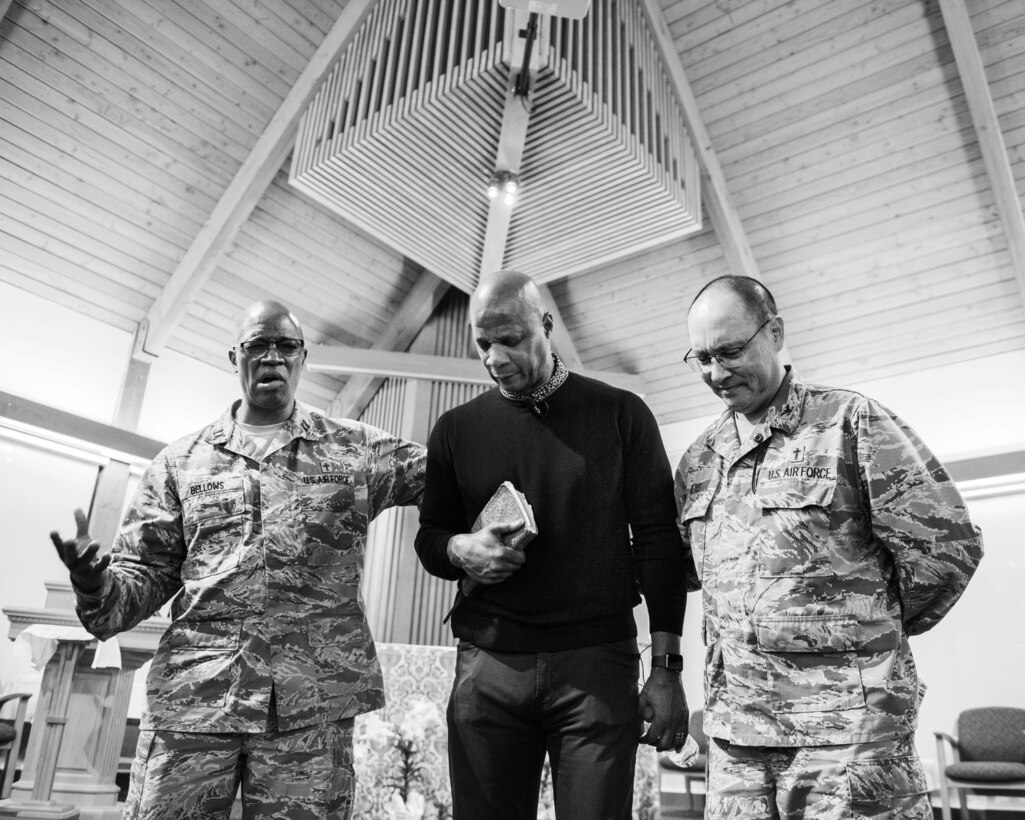 Maj. Kemuel Bellows, chaplain, former Major League Baseball player Darryl Strawberry, and Col. Kenneth Reyes, 60th Air Mobility Wing chaplain, pray after Strawberry’s presentation at Travis Air Force Base, Calif., April 11, 2018. The former Rookie of the Year and four-time World Series champion spent 17 years in the Majors. Strawberry’s addiction to drugs and other vices are well chronicled and now uses those experiences to motivate others. As a pastor, he uses his testimony to instill healing through spirituality. (U.S. Air Force photo by Louis Briscese)