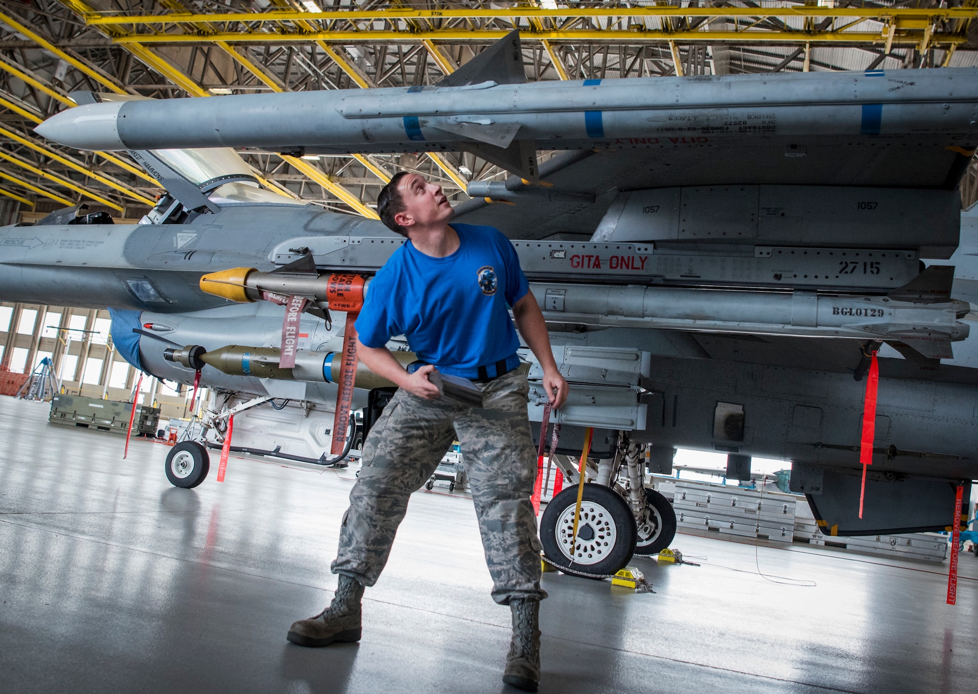 Staff Sgt. Trey Riley, member of the 96th Aircraft Maintenance Squadron blue team, performs load checks on his F-16 Fighting Falcon April 13, 2018, at Eglin Air Force Base, Fla. The blue team battled the AMU red team for weapons loadcrew supremacy during the quarterly competition. The red team claimed victory this quarter. (U.S. Air Force photo by Samuel King Jr.)