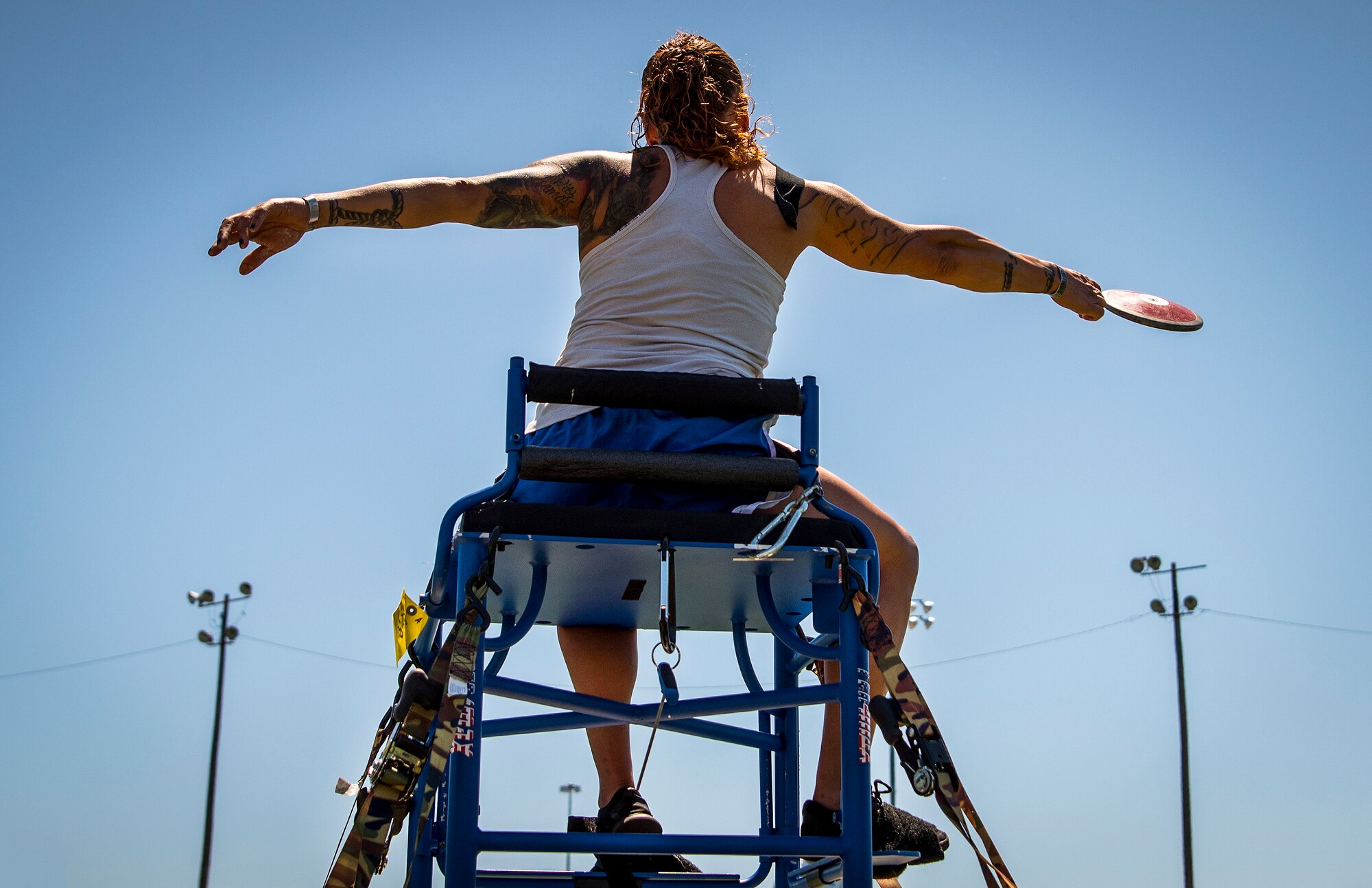 Kristina Coble, Warrior Games athlete, releases her disc during a track and field session at the Air Force team’s training camp at Eglin Air Force Base, Fla., April 17, 2018. The base-hosted, week-long Warrior Games training camp is the last team practice session before the yearly competition in June. (U.S. Air Force photo by Samuel King Jr.)