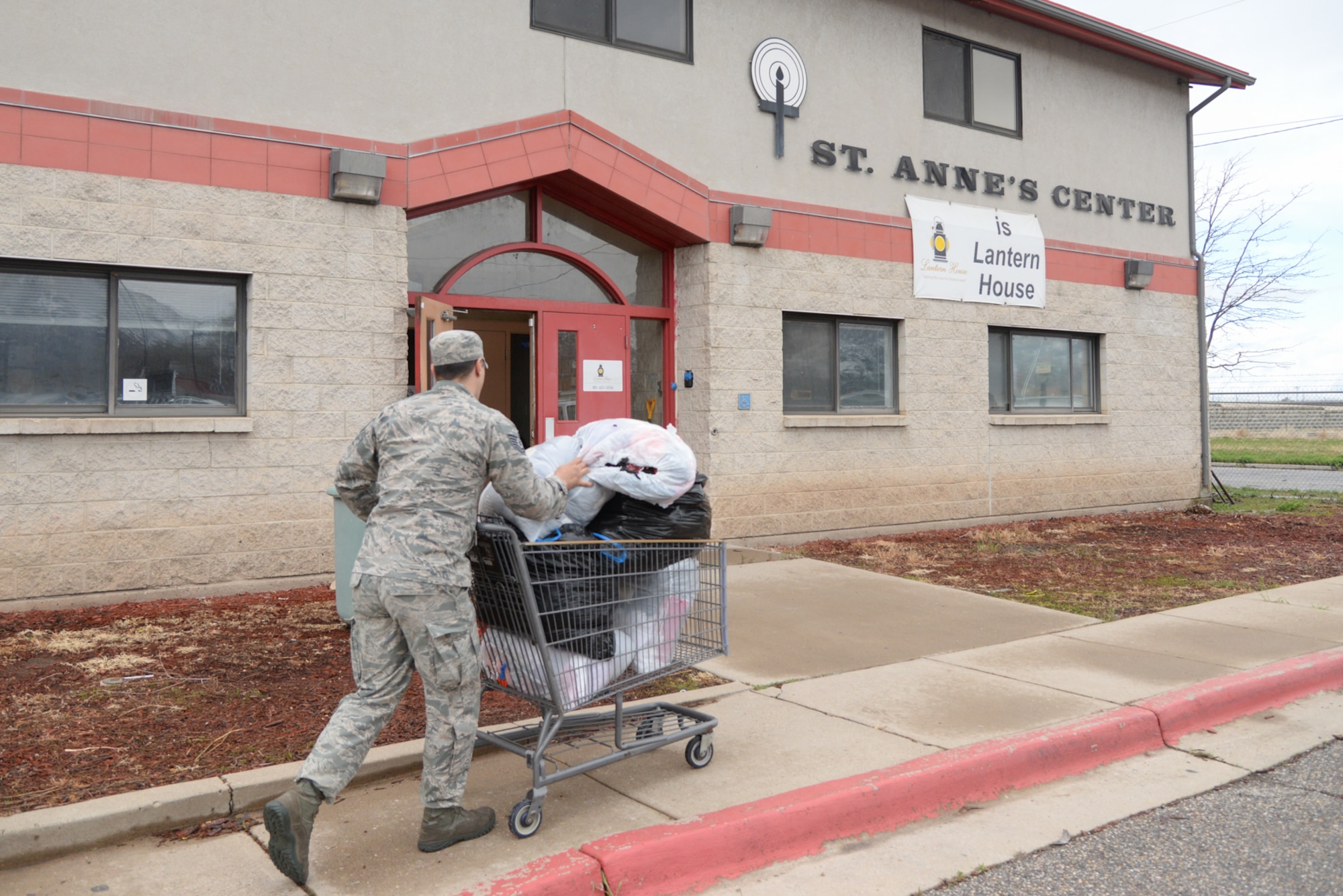 TSgt Tanner Atwood, 75th Logistics Readiness Squadron Vehicle Maintenance, delivers bags of clothing collected during a Hill Air Force Base, Utah clothing drive April 12, 2018, to take to The Lantern House and St. Anne's Center, homeless shelters in Ogden, Utah. (U.S. Air Force photo by Cynthia Griggs)
