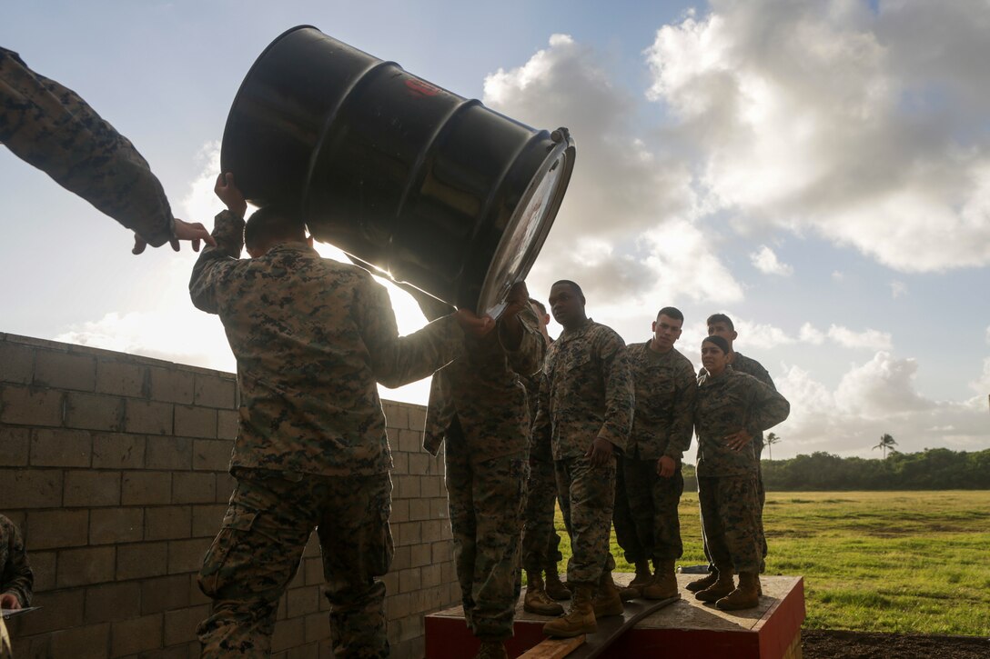 U.S. Marines with U.S. Marine Corps Forces, Pacific move simulated supplies through a leader’s reaction course station at Landing Zone Boondocker on Marine Corps Base Hawaii April 13, 2018. The Marines completed the obstacle course and leader’s reaction course to improve combat conditioning and enhance small unit leadership skills. (U.S. Marine Corps photo by Lance Cpl. Adam Montera)