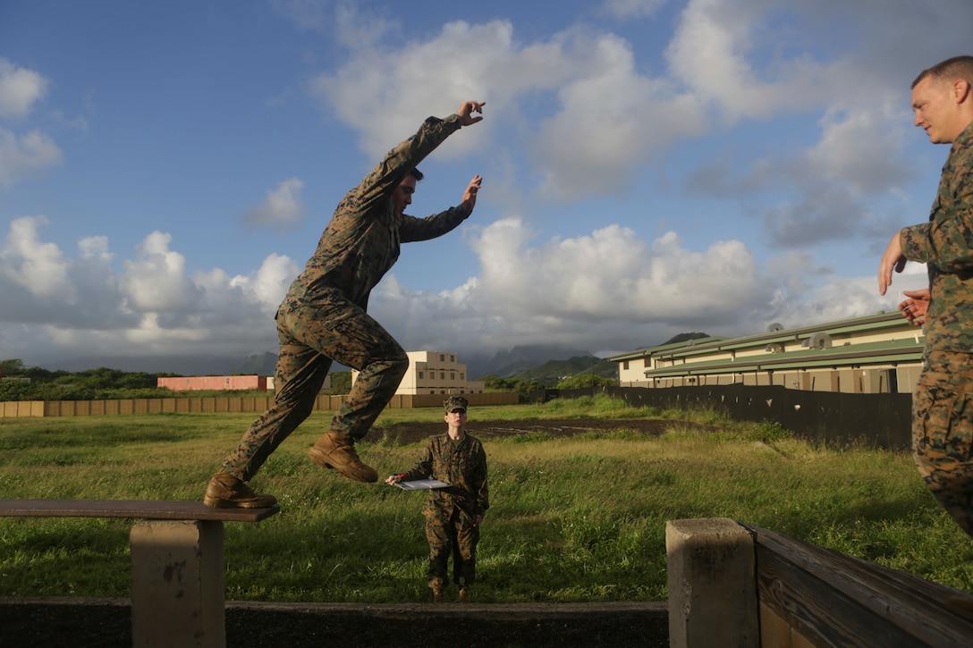 A U.S. Marine from U.S. Marine Corps Forces, Pacific jumps a leader’s reaction course station at Landing Zone Boondocker on Marine Corps Base Hawaii April 13, 2018. The Marines completed the obstacle course and leader’s reaction course to improve combat conditioning and enhance small unit leadership skills. (U.S. Marine Corps photo by Lance Cpl. Adam Montera)