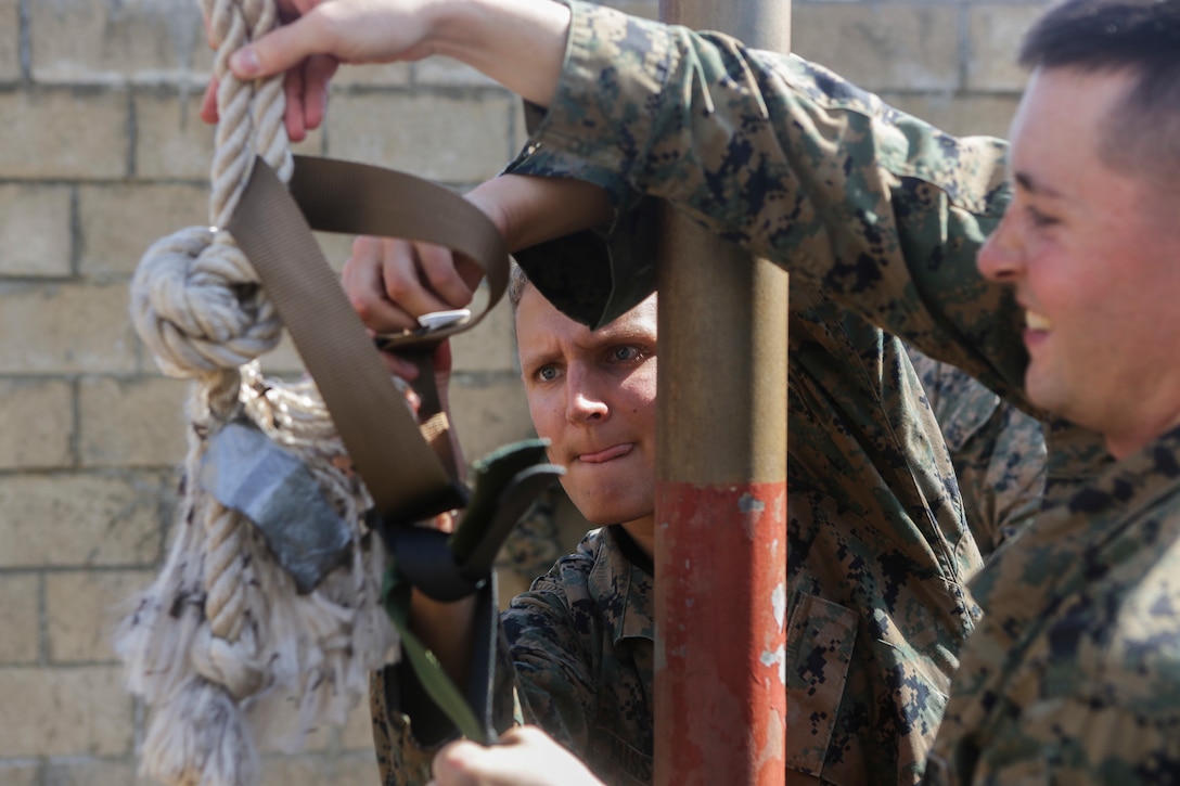 U.S. Marines with U.S. Marine Corps Forces, Pacific improvise a way to carry ammo cans across a leader’s reaction course station at Landing Zone Boondocker on Marine Corps Base Hawaii April 13, 2018. The Marines completed the obstacle course and leader’s reaction course to improve combat conditioning and enhance small unit leadership skills. (U.S. Marine Corps photo by Lance Cpl. Adam Montera)