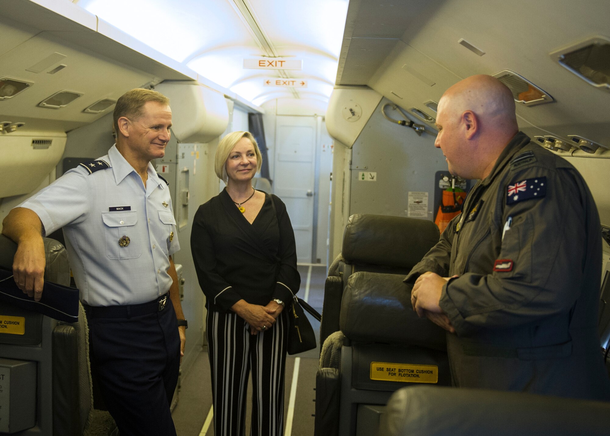 (Left) U.S. Air Force Maj. Gen. Russell L. Mack, Pacific Air Forces deputy commander, and Australian Consulate General Ambassador Jane Hardy, receive a brief on the Royal Australian Air Force (RAAF) E-7A Wedgetail capabilities from RAAF Squadron Leader Samuel Thorpe, No. 2 Squadron executive officer, at Joint Base Pearl Harbor-Hickam, April 14, 2018.