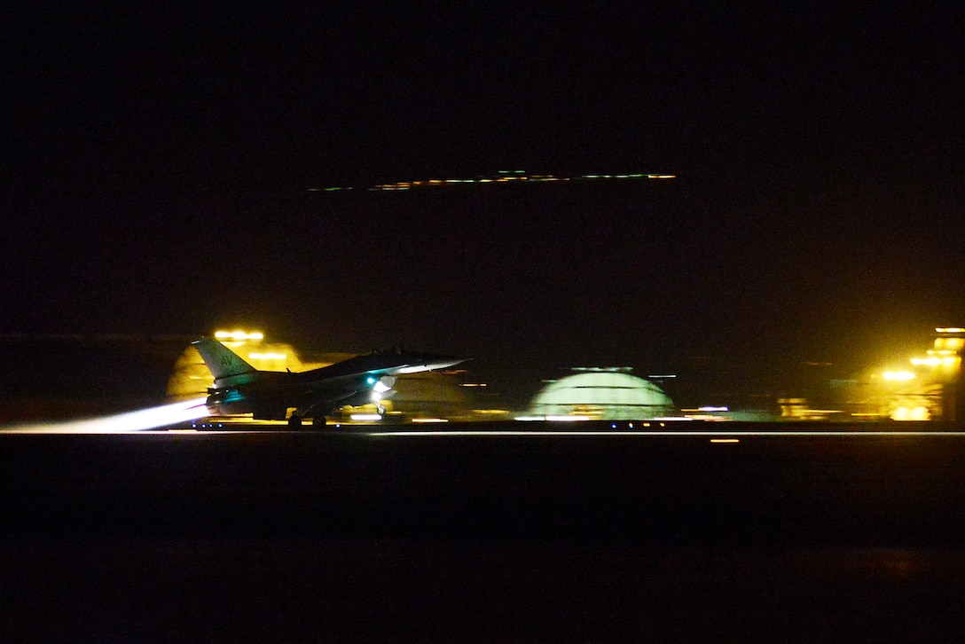 An aircraft takes off at night.