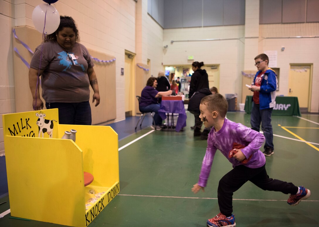 Ethan, son of Army Chief Warrant Officer 3 Matthew Thomas, throws a beanbag at a milk jug game during the Month of the Military Child Carnival at Joint Base Elmendorf-Richardson’s 2 Rivers Youth Center, April 13, 2018. The event consisted of games, cotton candy, popcorn, face painting and more. April is the Month of the Military Child, highlighting the significant role military children play in the armed forces community.