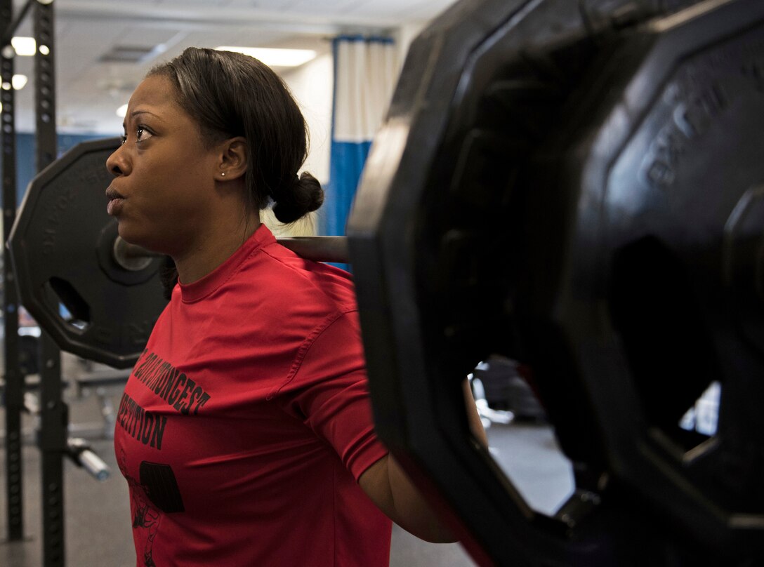 U.S. Air Force Staff Sgt. Ashley Bethel, 33rd Maintenance Squadron Command Support Staff noncomissioned officer in charge, performs a back squat  March 29, 2018, at Eglin Air Force Base, Fla. Bethel competed in the Eglin's Strongest Competition where she back squatted 250 pounds, bench pressed 155 pounds and deadlifted 275 pounds. (U.S. Air Force photo by Airman 1st Class Daniella Peña-Pavao)