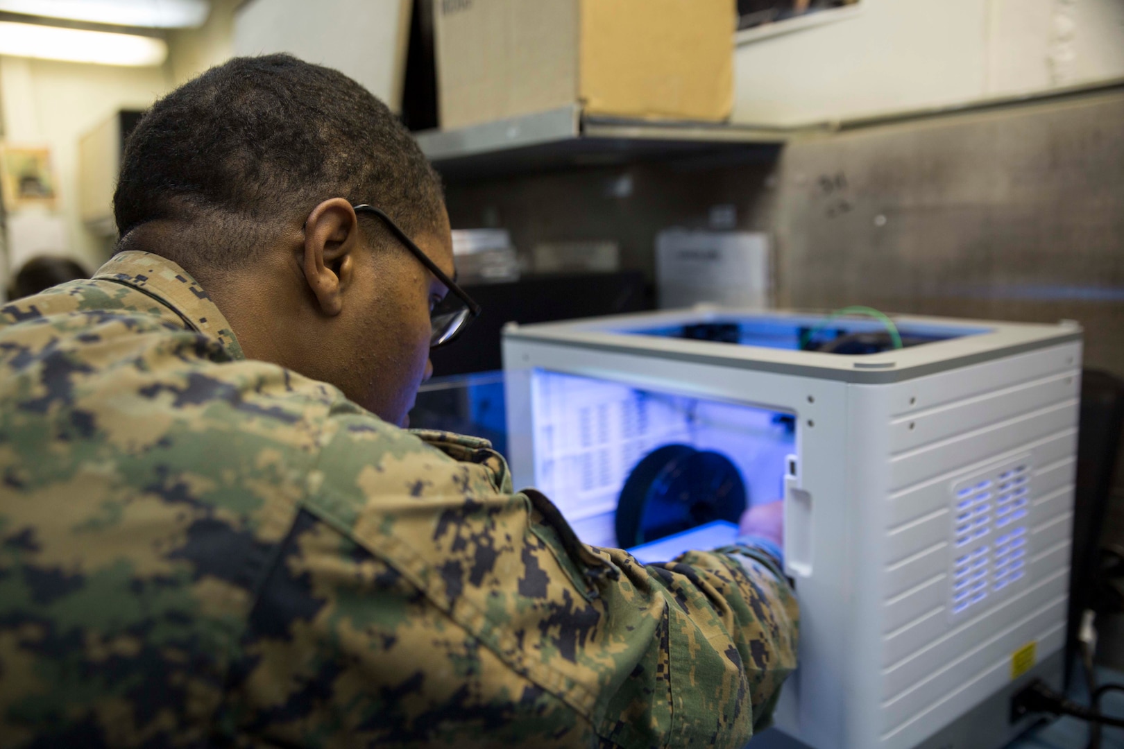 Marine with Combat Logistics Battalion 31, 31st Marine Expeditionary Unit, prepares to print 3D model aboard USS Wasp while underway in Pacific Ocean, April 7, 2018 (U.S. Marine Corps/Bernadette Wildes)
