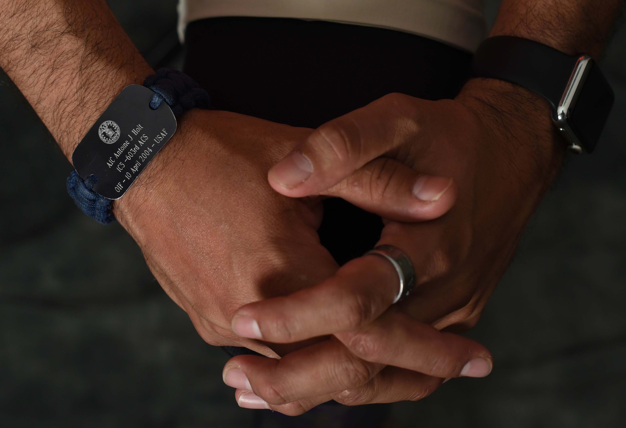 Image of an Airman with his hands crossed.