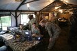 Soldiers in tent on computers